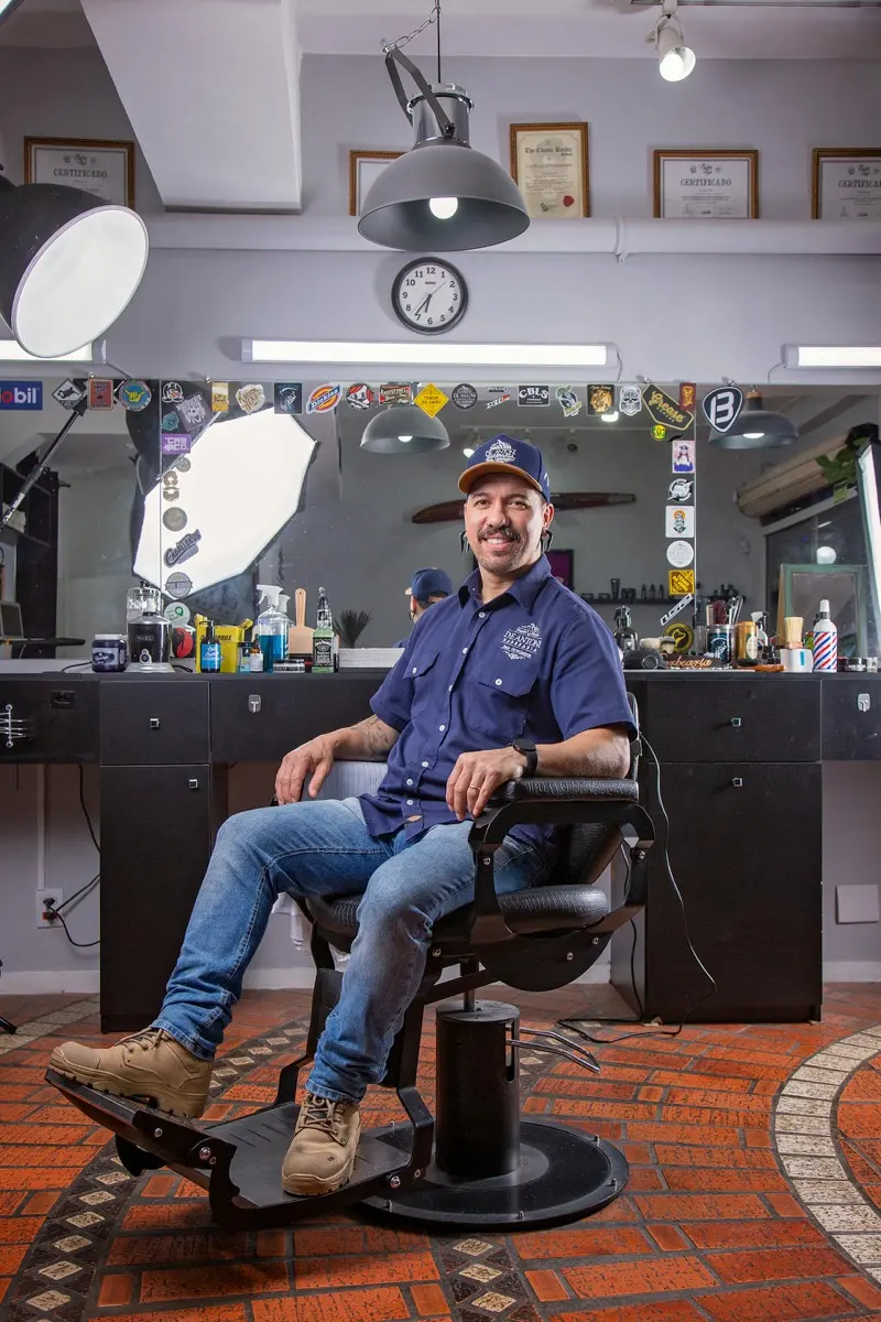 Barber sitting in his chair in a classic barbershop