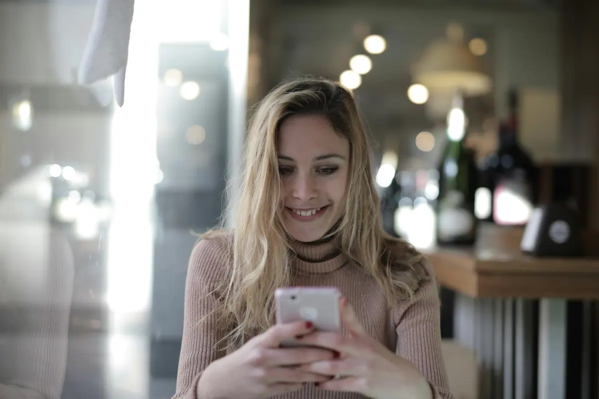 Client booking a hair appointment on her phone